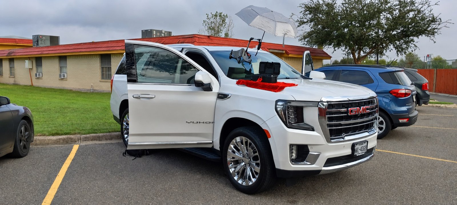 Premier Windshield mobile setup working on a red Ford Expedition in McAllen, Texas