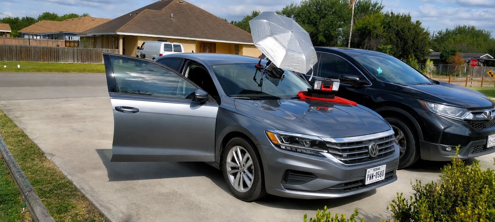 Premier Windshield mobile setup working on a Volkswagen Passat in a Palmview, Texas driveway